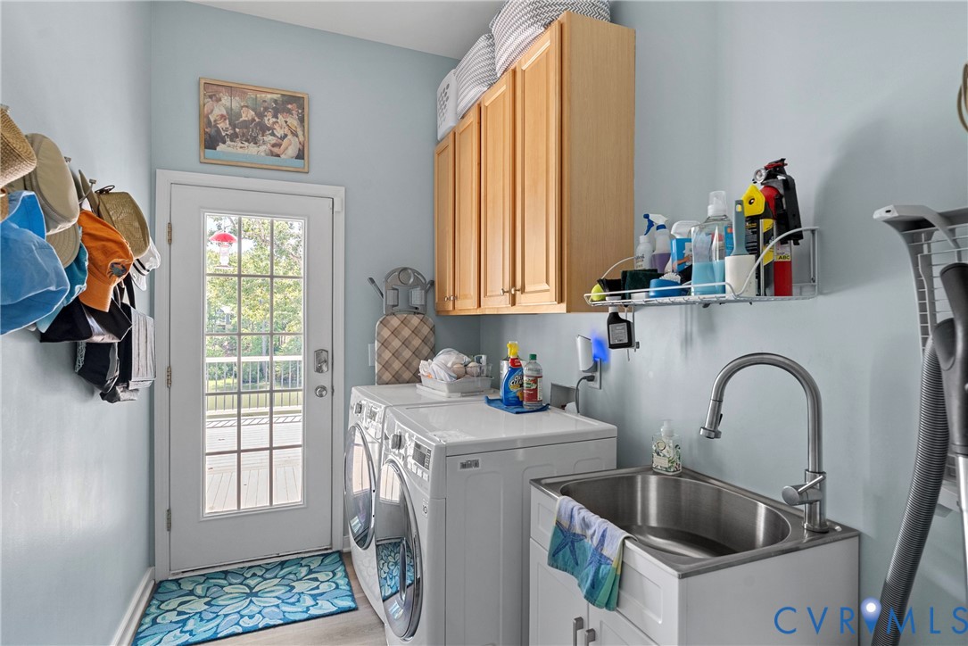 935 Ring Farm Road White Stone, VA 22578 - Photo 24 of 52 Laundry area featuring washer and dryer, cabinet s