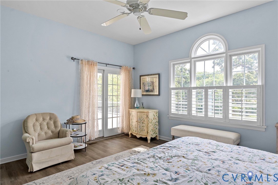 935 Ring Farm Road White Stone, VA 22578 - Photo 26 of 52 Bedroom with access to outside, wood finished floo