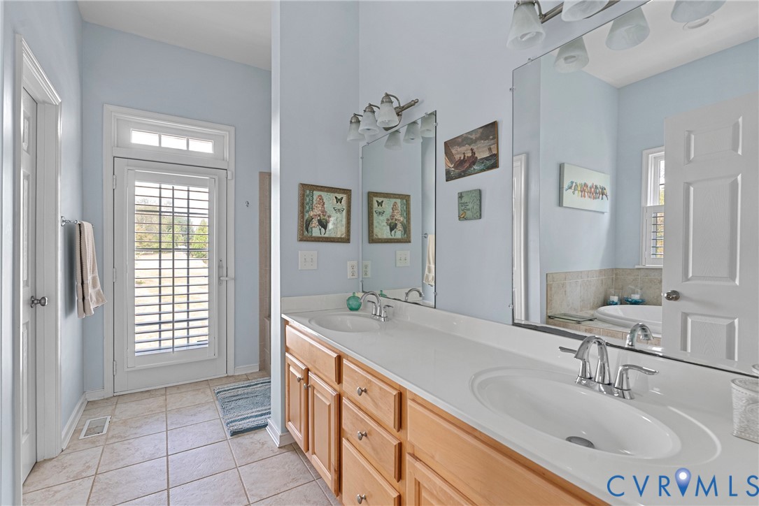 935 Ring Farm Road White Stone, VA 22578 - Photo 28 of 52 Full bath featuring double vanity, light tile patt