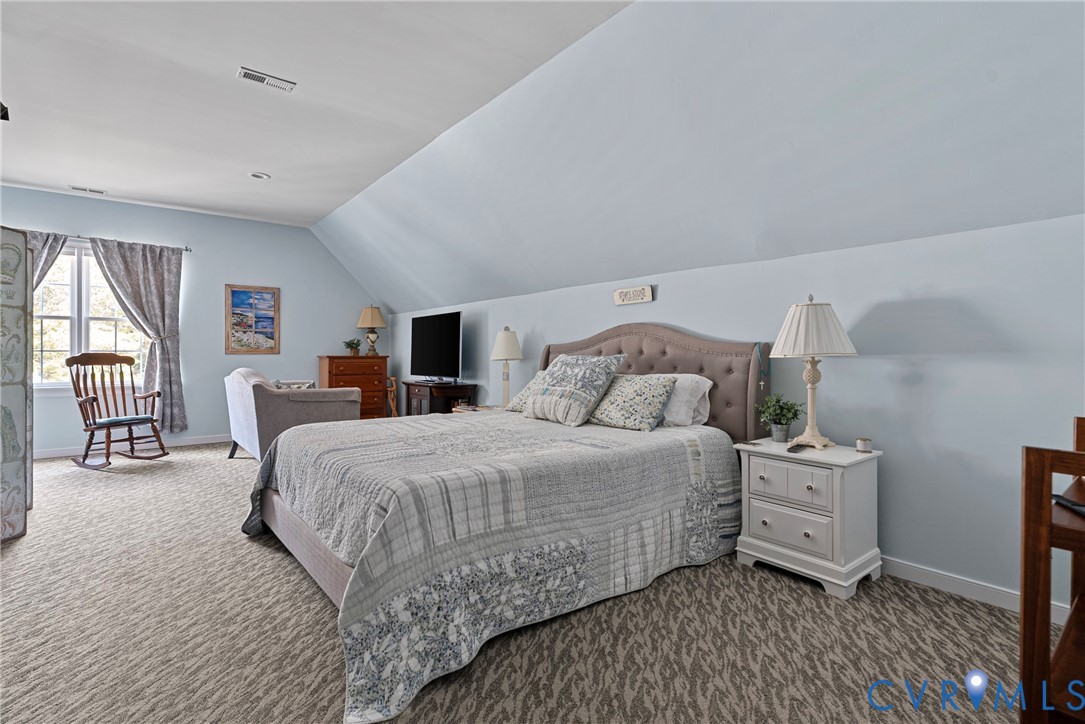 935 Ring Farm Road White Stone, VA 22578 - Photo 37 of 52 Bedroom featuring lofted ceiling and carpet floori