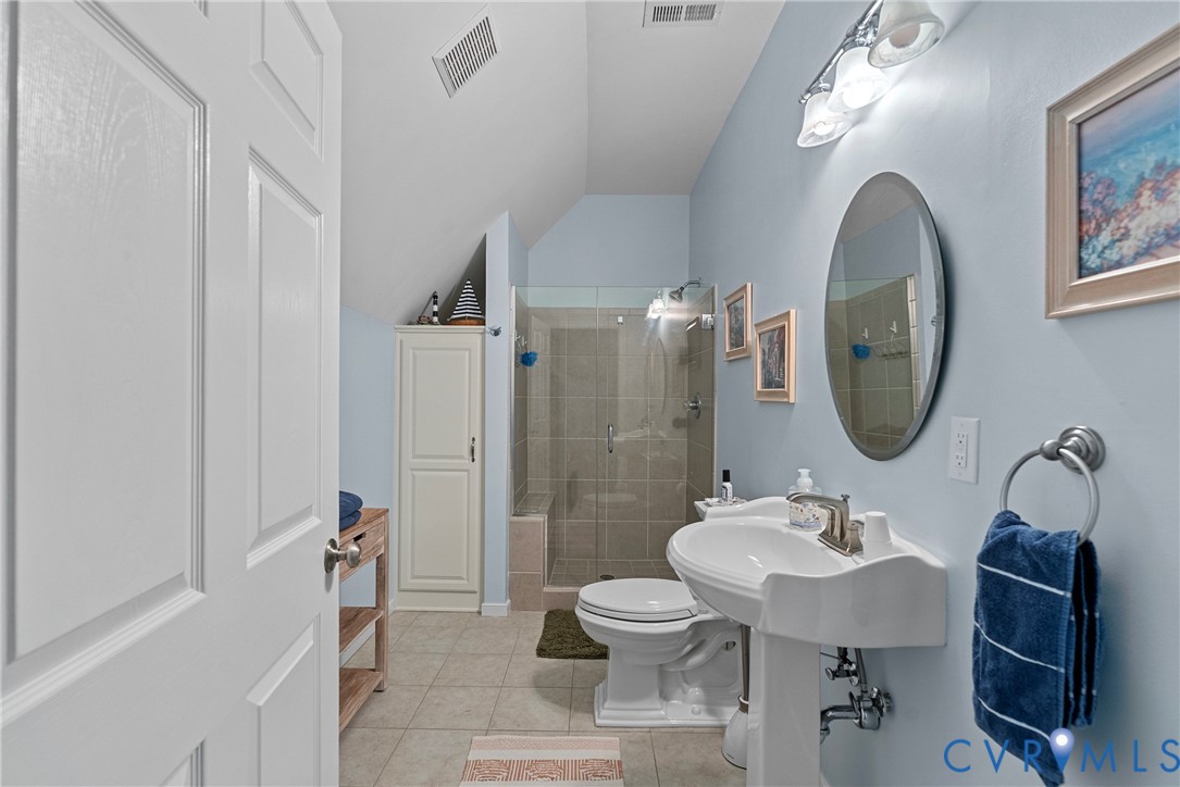 935 Ring Farm Road White Stone, VA 22578 - Photo 39 of 52 Full bathroom featuring lofted ceiling, a stall sh