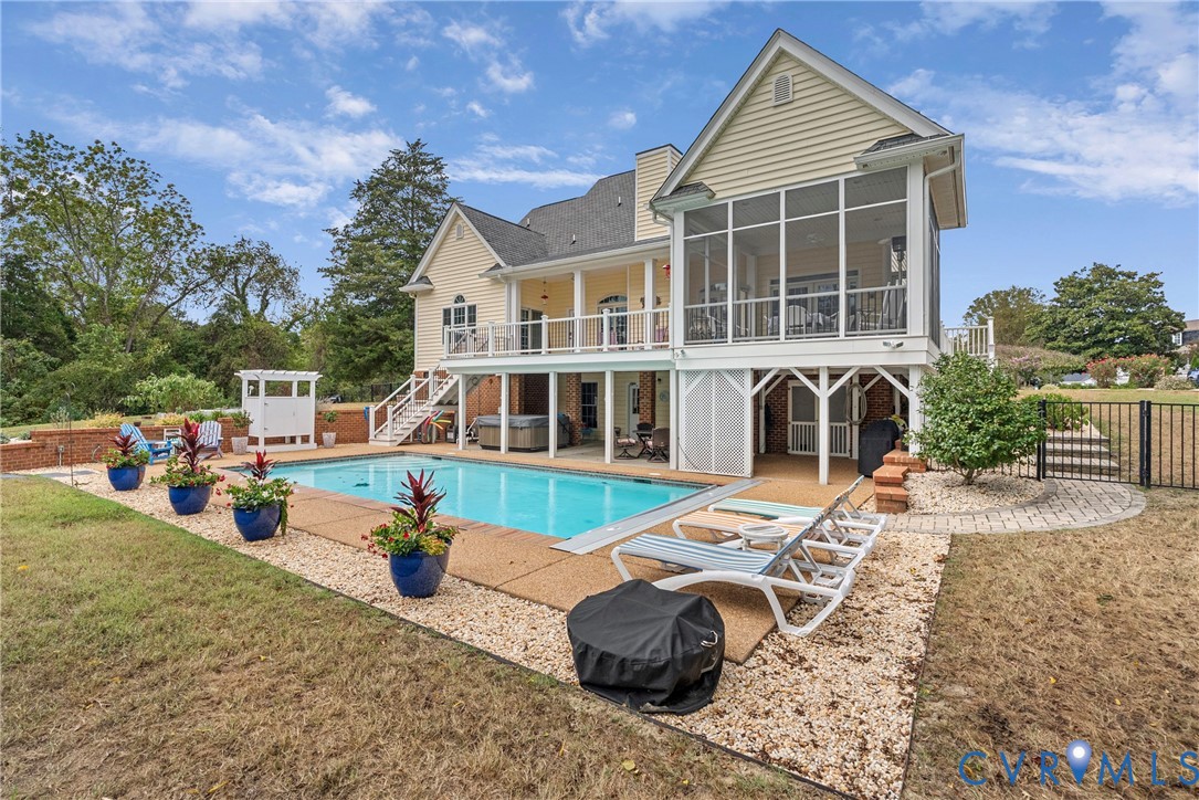 935 Ring Farm Road White Stone, VA 22578 - Photo 47 of 52 Back of property with a patio area, a sunroom, and