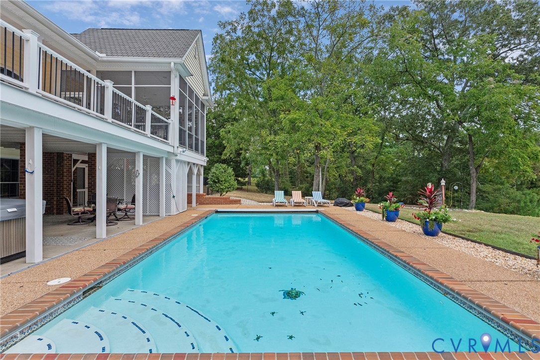 935 Ring Farm Road White Stone, VA 22578 - Photo 8 of 52 Swimming pool featuring a sunroom, a patio, a balc