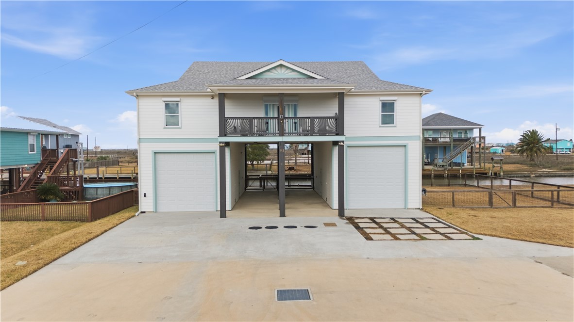 142-143 Channelview Road Rockport, TX 78382 - Photo 2 of 40 a front view of a house with a porch