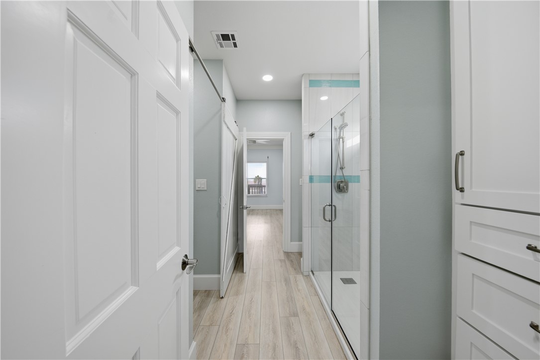 142-143 Channelview Road Rockport, TX 78382 - Photo 22 of 40 a bathroom with a shower and a glass door