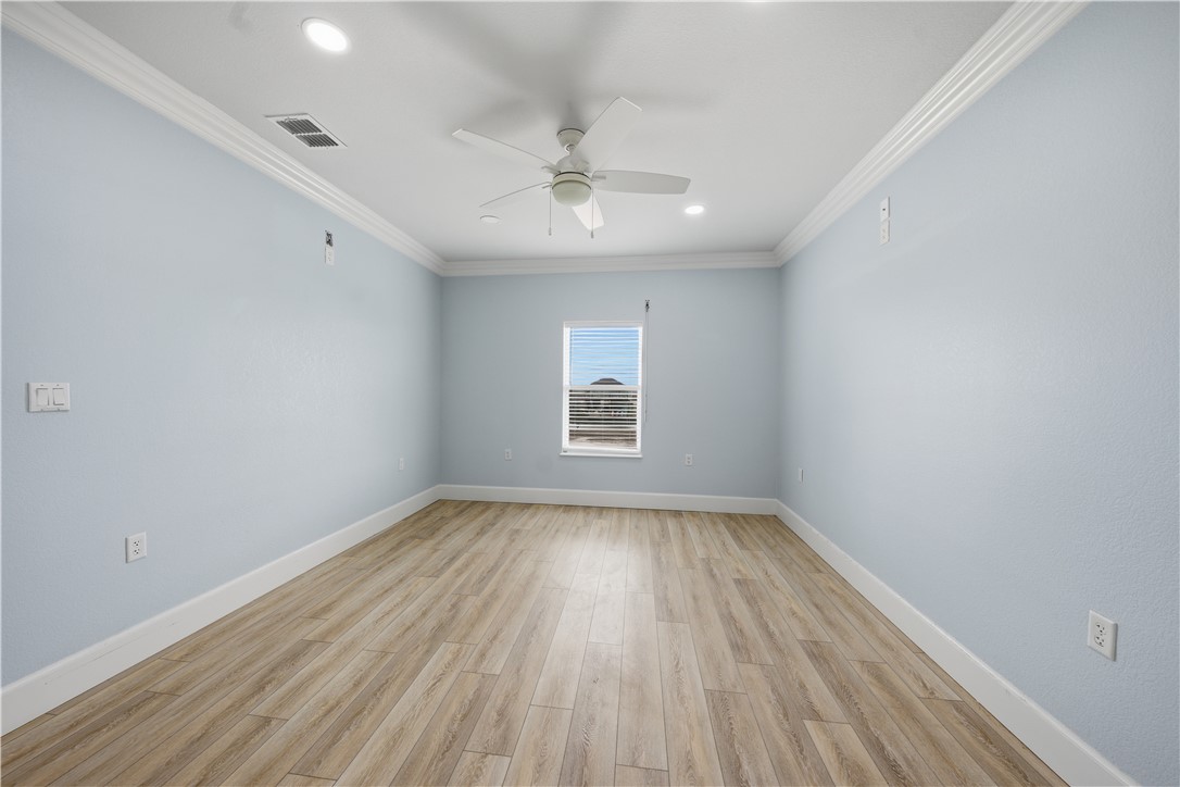 142-143 Channelview Road Rockport, TX 78382 - Photo 29 of 40 wooden floor in an empty room with a window