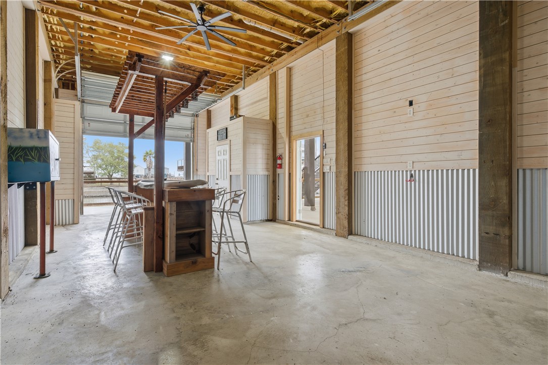 142-143 Channelview Road Rockport, TX 78382 - Photo 33 of 40 a view of a patio with table and chairs and potted plants
