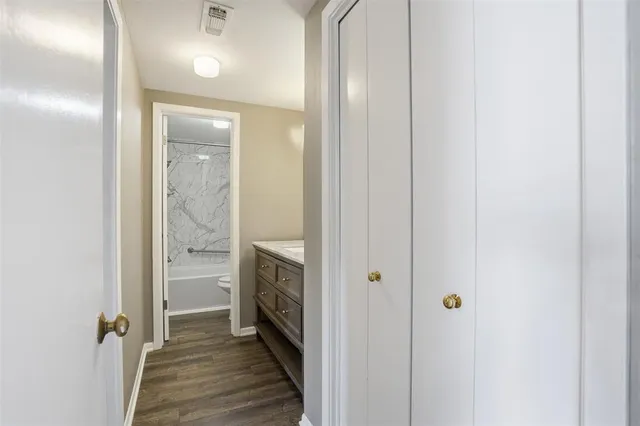 a view of a bathroom from the hallway