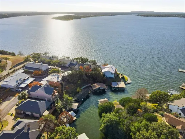 a view of a brick house with many windows