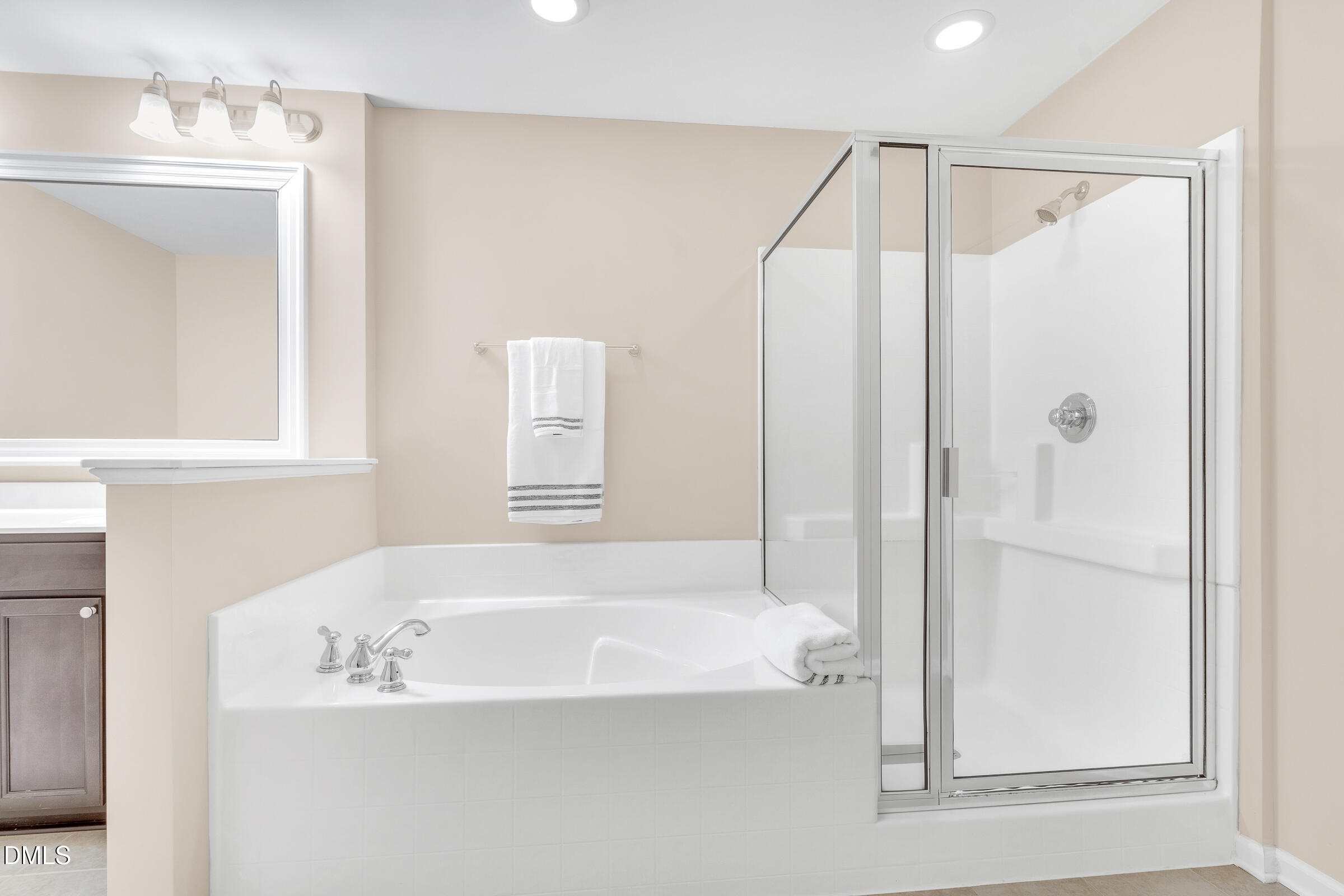 1304 Regulator Street Raleigh, NC 27603 - Photo 16 of 35 a bathroom with a bathtub and a shower