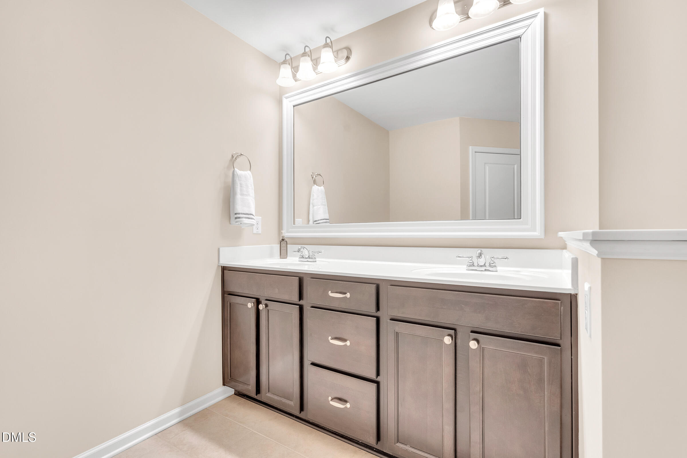 1304 Regulator Street Raleigh, NC 27603 - Photo 17 of 35 a bathroom with a sink and a mirror