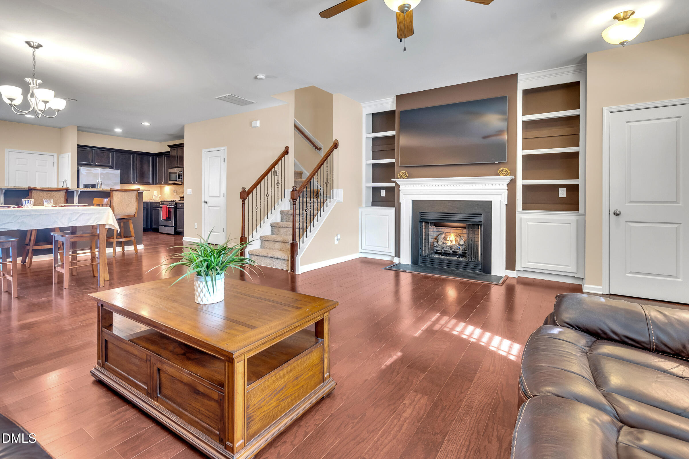 1304 Regulator Street Raleigh, NC 27603 - Photo 7 of 35 a living room with furniture and a fireplace
