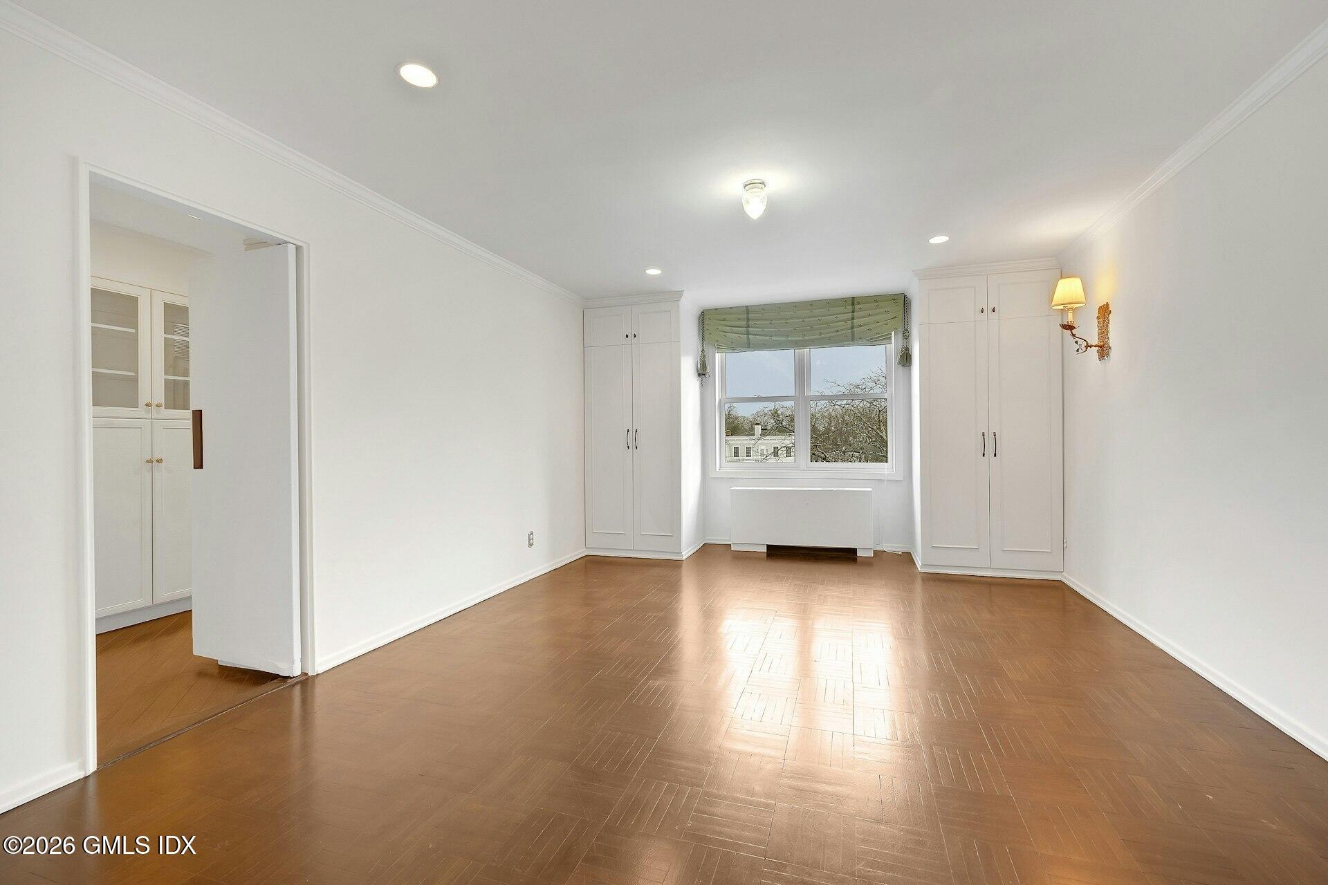 630 Steamboat Road, Unit 4AN Greenwich, CT 06830 - Photo 10 of 32 a view of a room with wooden floor and window