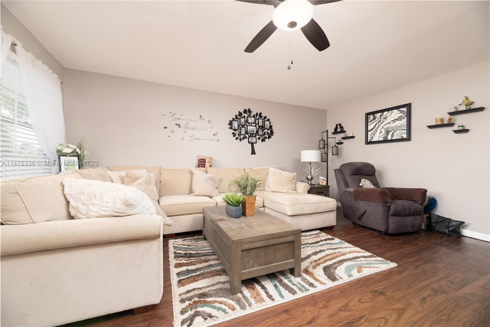 2085 Exeter, Unit 2085 Boca Raton, FL 33434 - Photo 3 of 20 a living room with furniture and a window