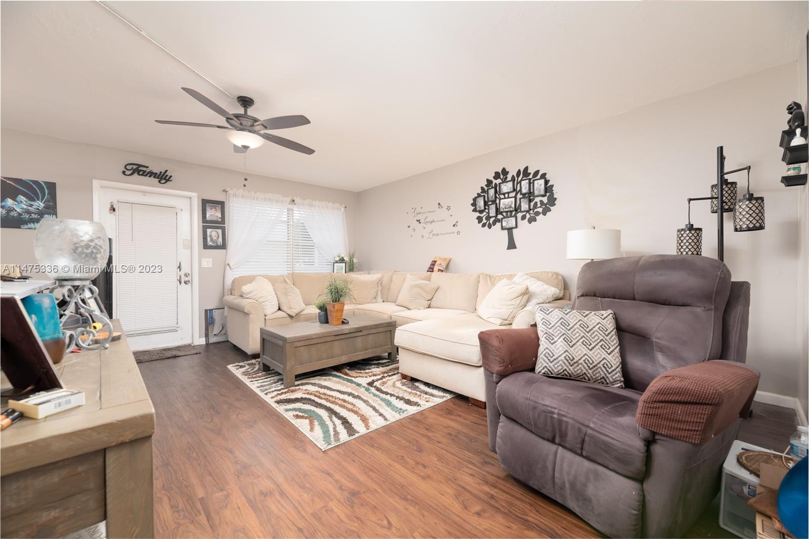2085 Exeter, Unit 2085 Boca Raton, FL 33434 - Photo 4 of 20 a living room with furniture and a wooden floor