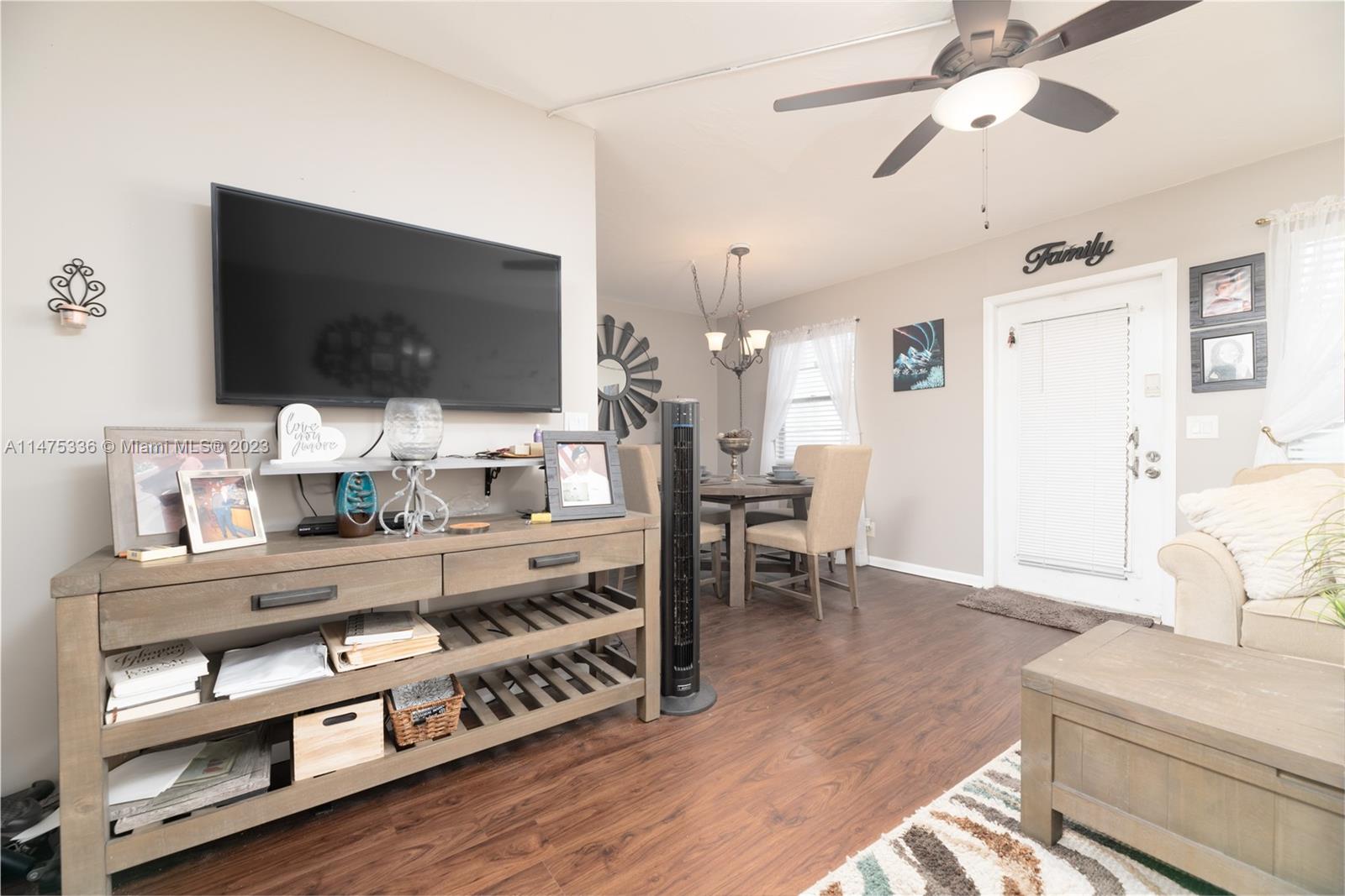 2085 Exeter, Unit 2085 Boca Raton, FL 33434 - Photo 5 of 20 a living room with furniture and a flat screen tv