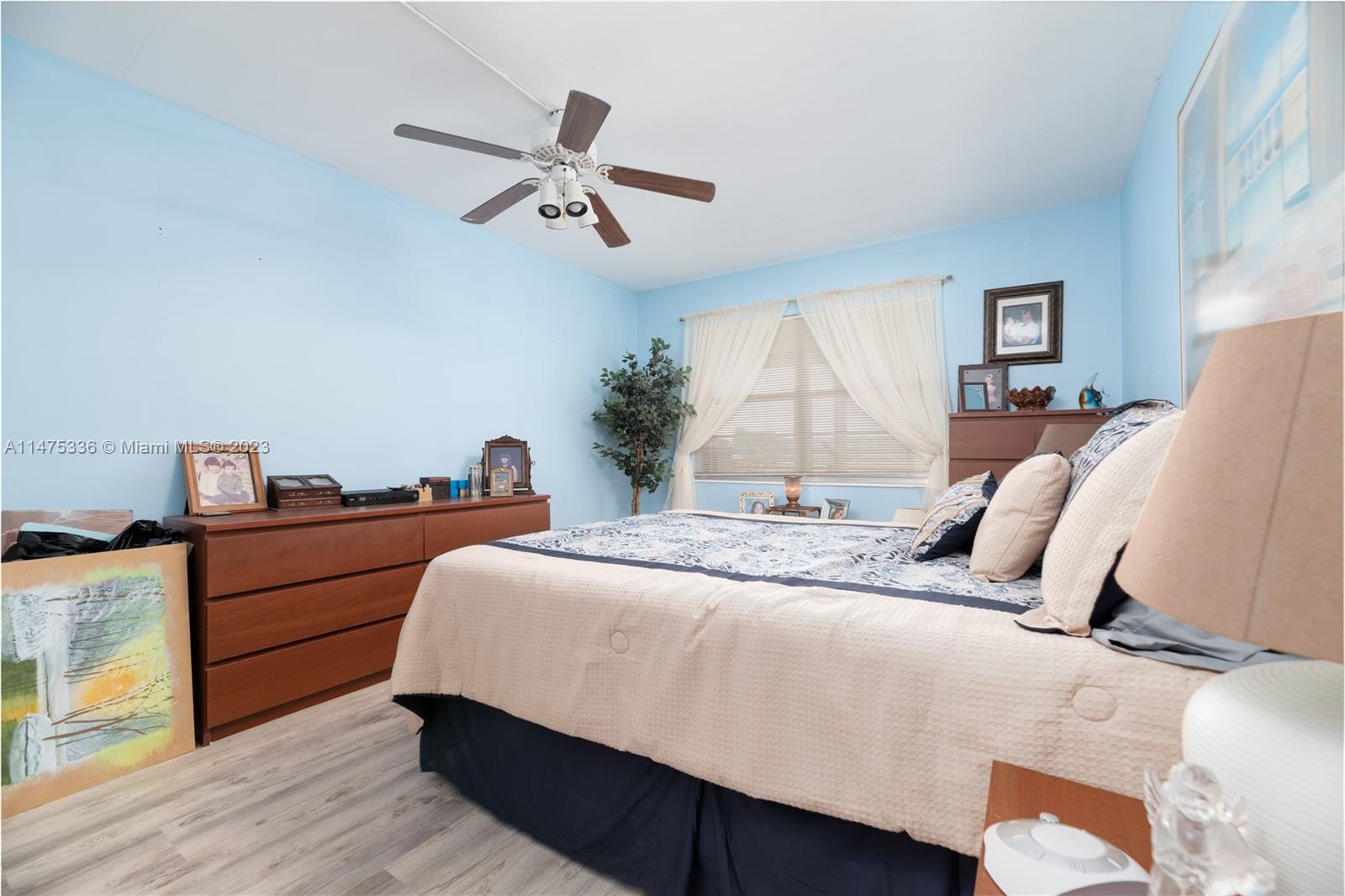 2085 Exeter, Unit 2085 Boca Raton, FL 33434 - Photo 10 of 20 a bedroom with a bed and wooden floor