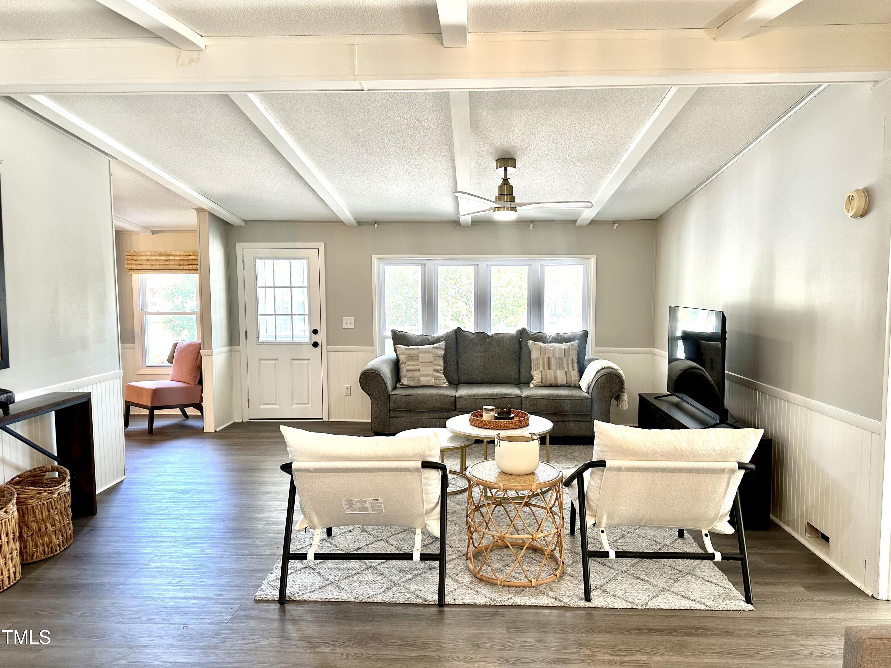 232 Hardy Hollow Road Semora, NC 27343 - Photo 8 of 49 a living room with furniture and wooden floor