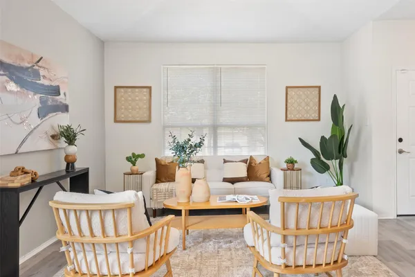 a living room with furniture and a potted plant