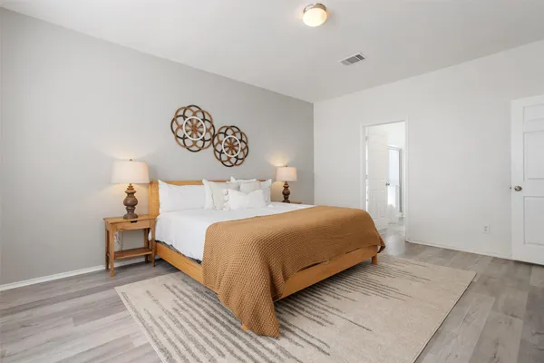 a bedroom with a bed and a table