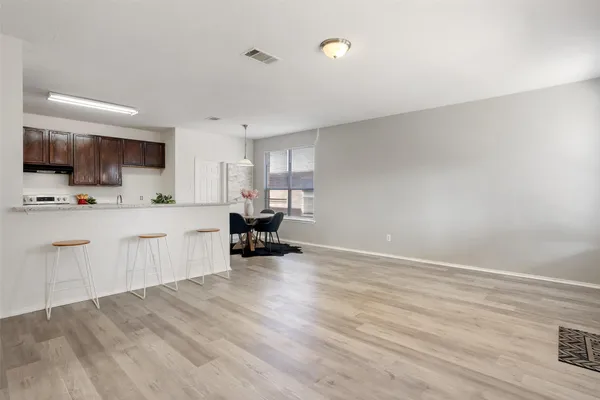 a kitchen with sink and cabinets