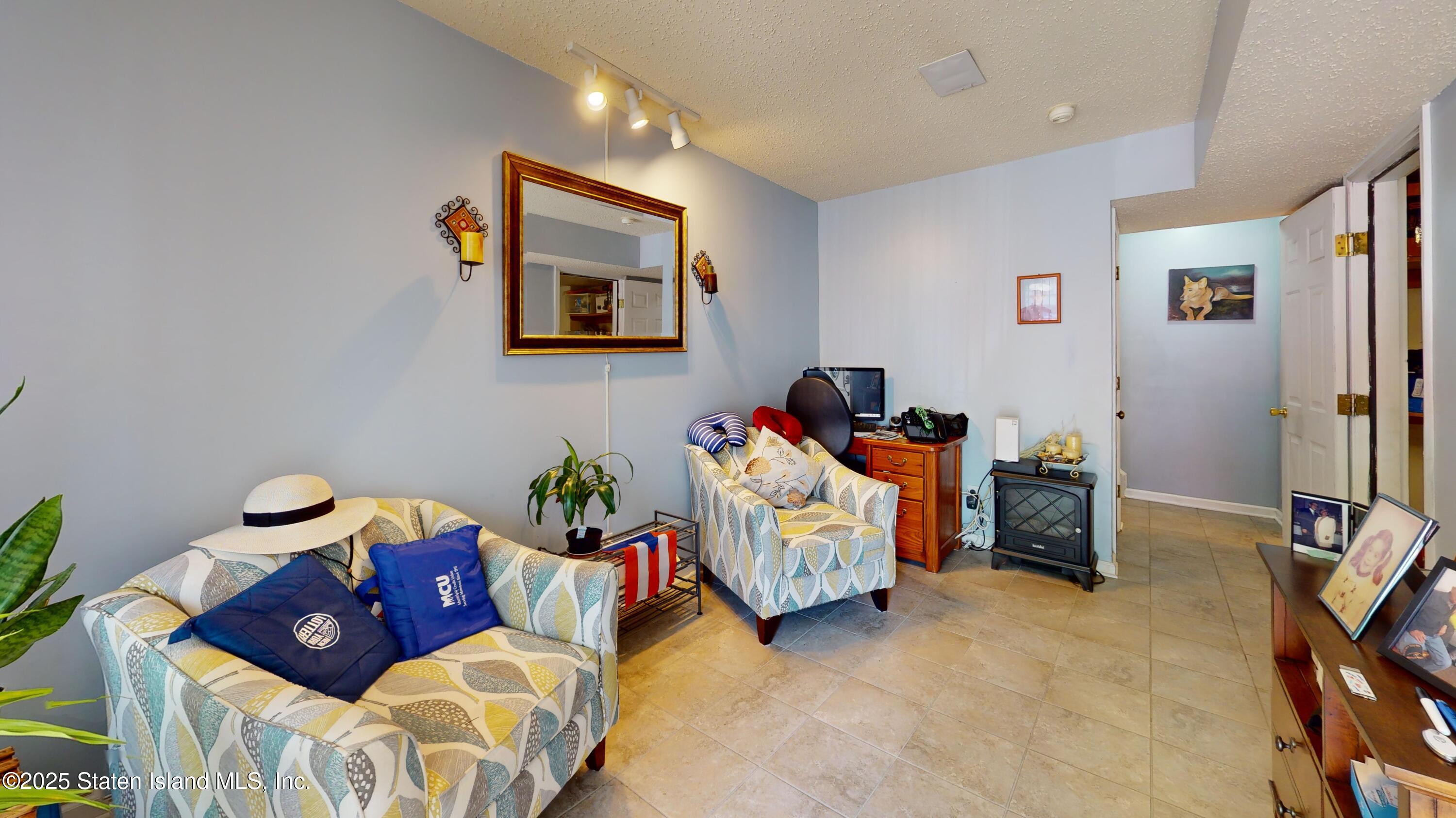 235 Ilyssa Way Staten Island, NY 10312 - Photo 4 of 30 a bed room with furniture and a bed