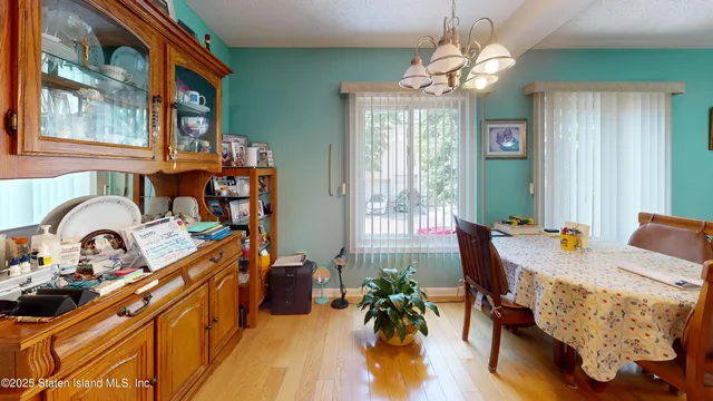 a bedroom with furniture and a large window