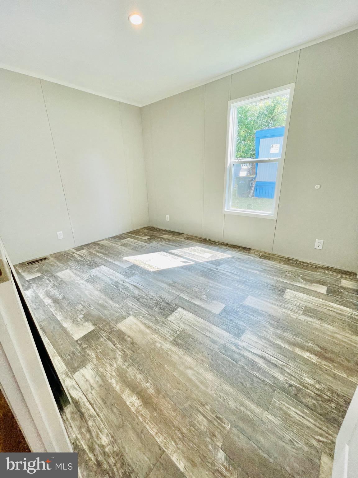 86 Cherokee Avenue Dover, PA 17315 - Photo 23 of 38 a view of a room with wooden floor and window