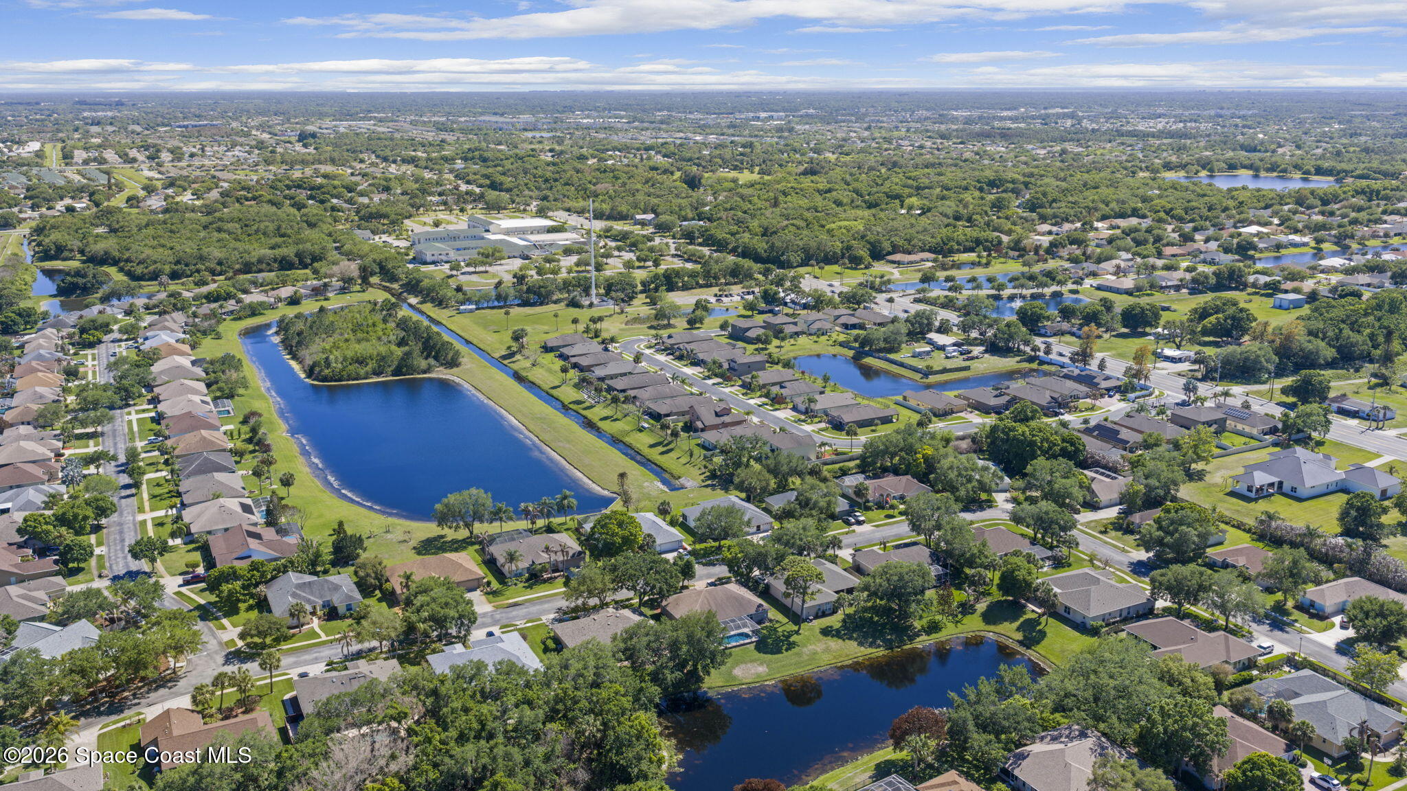 1123 Spring Oak Drive Melbourne, FL 32901 - Photo 60 of 67 an aerial view of residential houses with outdoor space and trees