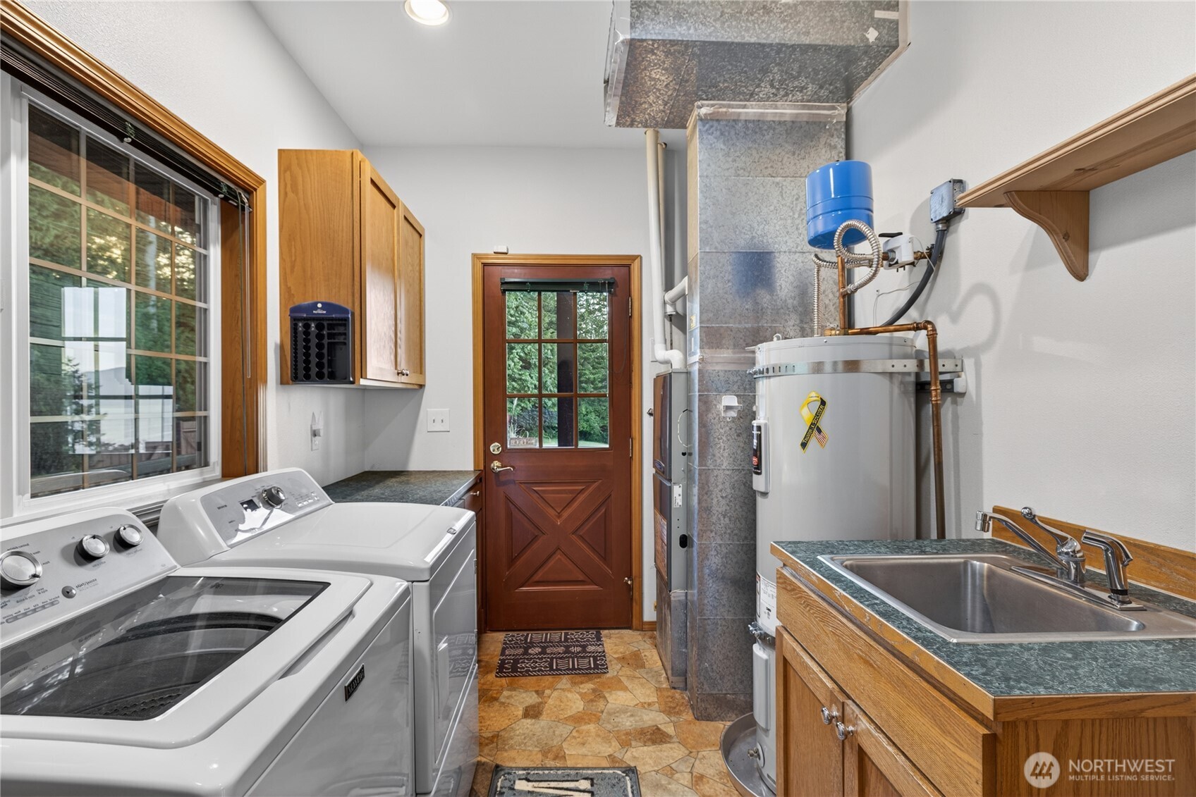 4623 Guemes Island Road Anacortes, WA 98221 - Photo 24 of 40 a kitchen that has a sink and a stove