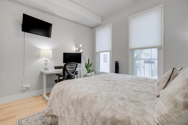 a bedroom with a bed and tv