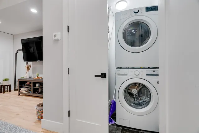a view of a hallway with washer and dryer