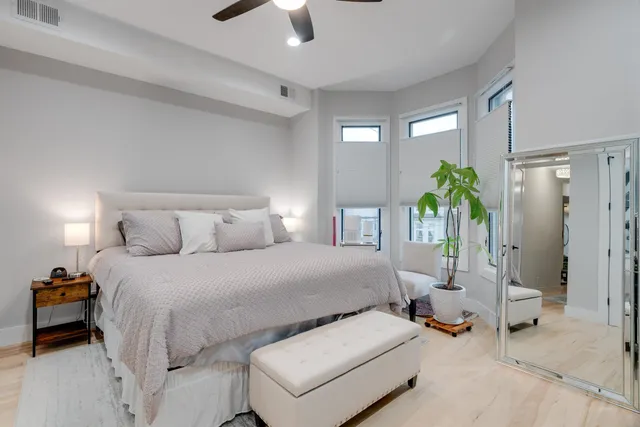 a bed room with a bed and a window