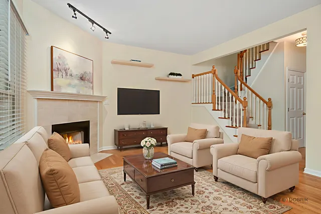 a living room with furniture fireplace and a flat screen tv