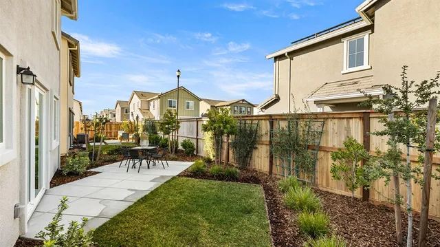 a view of a house with a yard and balcony