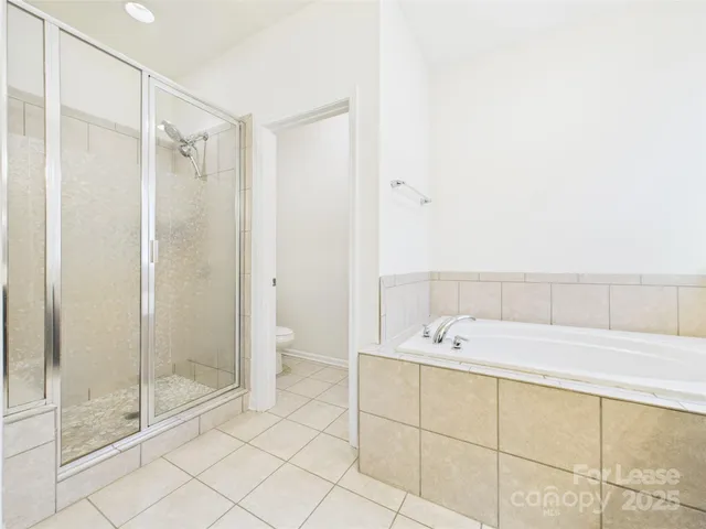 a bathroom with a tub and a shower