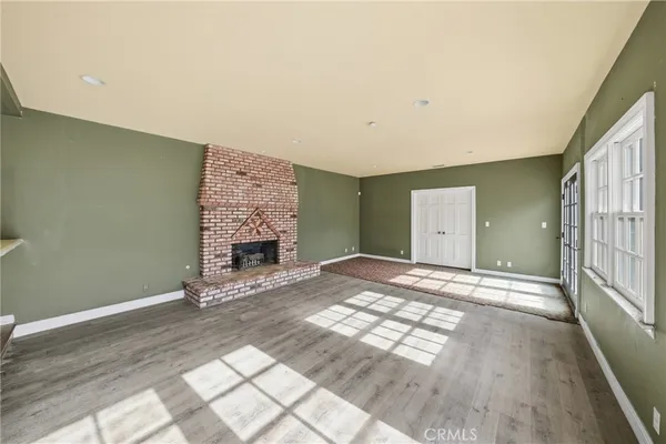 a kitchen with granite countertop stainless steel appliances a sink stove top oven and cabinets