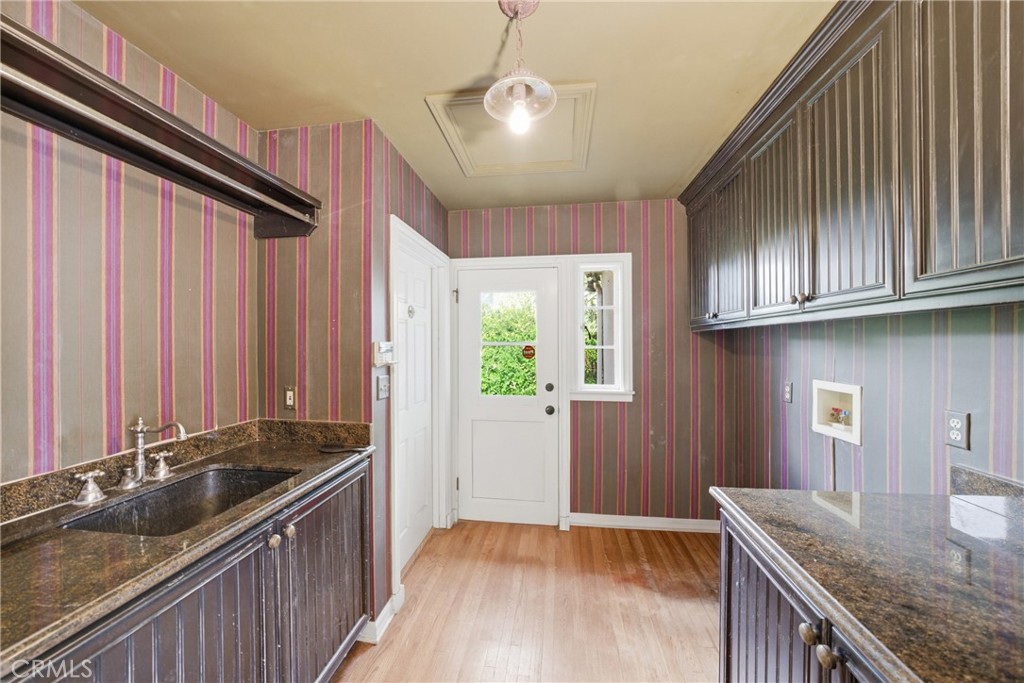 1210 Rodeo Road Arcadia, CA 91006 - Photo 12 of 45 a kitchen with granite countertop stainless steel appliances a sink stove top oven and cabinets