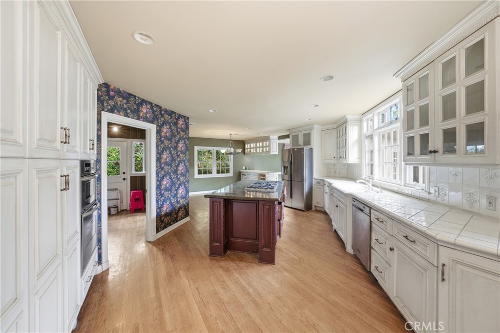 1210 Rodeo Road Arcadia, CA 91006 - Photo 15 of 45 a large kitchen with a lot of counter space and wooden floor