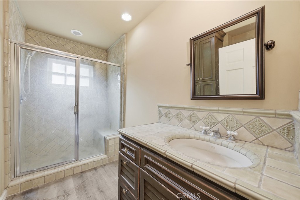 1210 Rodeo Road Arcadia, CA 91006 - Photo 17 of 45 a bathroom with a sink and a mirror