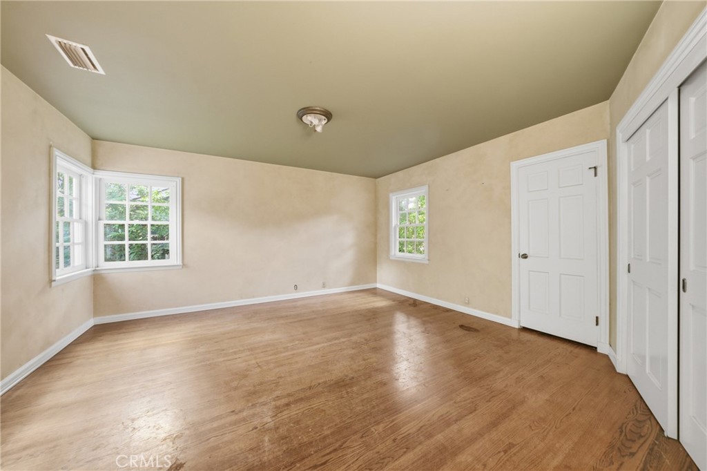 1210 Rodeo Road Arcadia, CA 91006 - Photo 19 of 45 an empty room with windows and closet