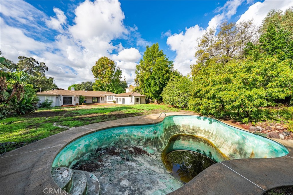 1210 Rodeo Road Arcadia, CA 91006 - Photo 44 of 45 a view of a garden with a bench in the background