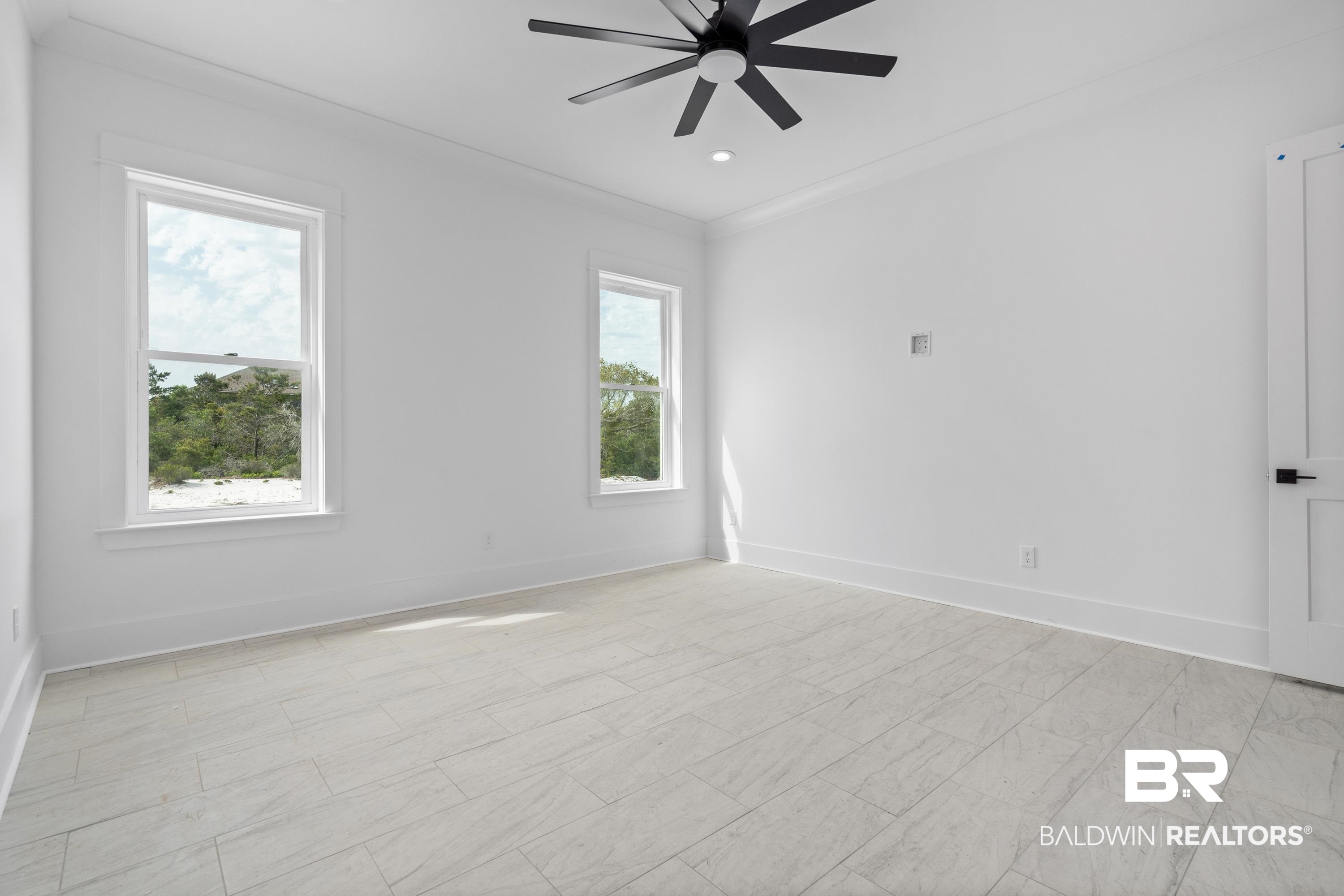 30650 Ono N Loop West Orange Beach, AL 36561 - Photo 16 of 38 Empty room with ceiling fan, baseboards, and crown molding