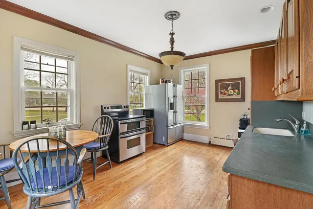 a view of a livingroom with furniture window and wooden floor