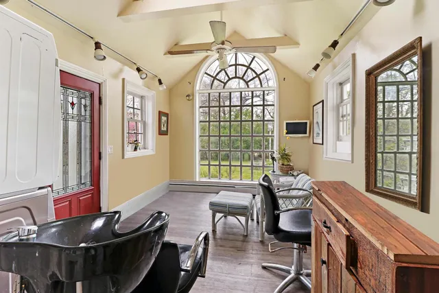 a view of a livingroom with furniture and window