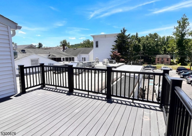 1 North Main Street, Unit 2 Stockton, NJ 08559 - Photo 3 of 12 a view of balcony with wooden floor and fence