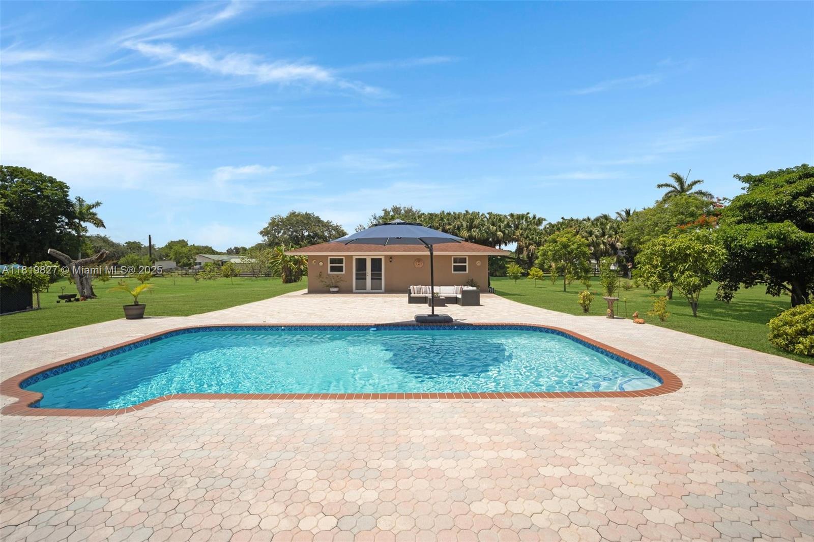 12851 Luray Road Southwest Ranches, FL 33330 - Photo 13 of 58 a view of a big yard with potted plants