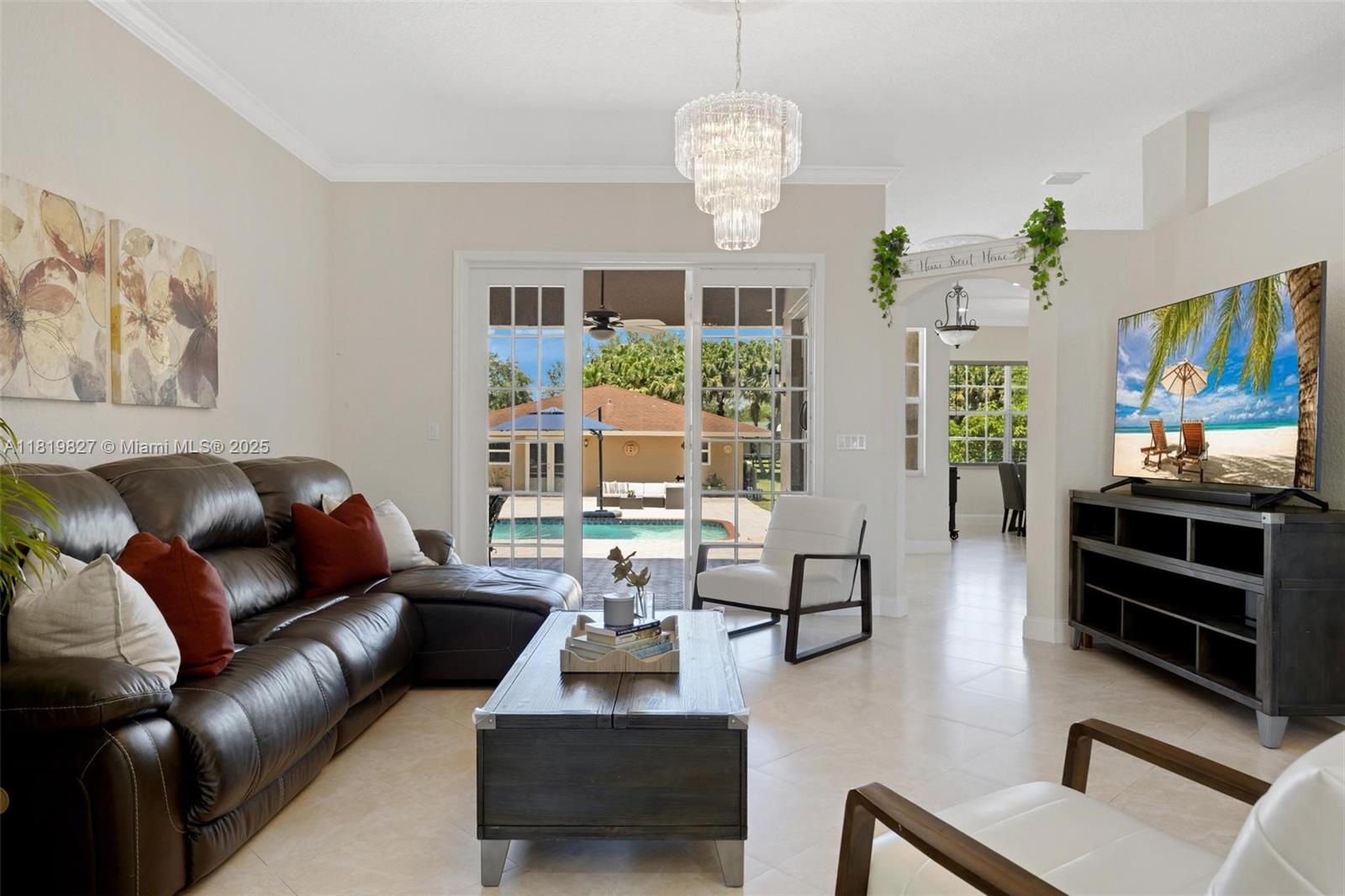 12851 Luray Road Southwest Ranches, FL 33330 - Photo 3 of 58 a living room with fireplace furniture and a flat screen tv