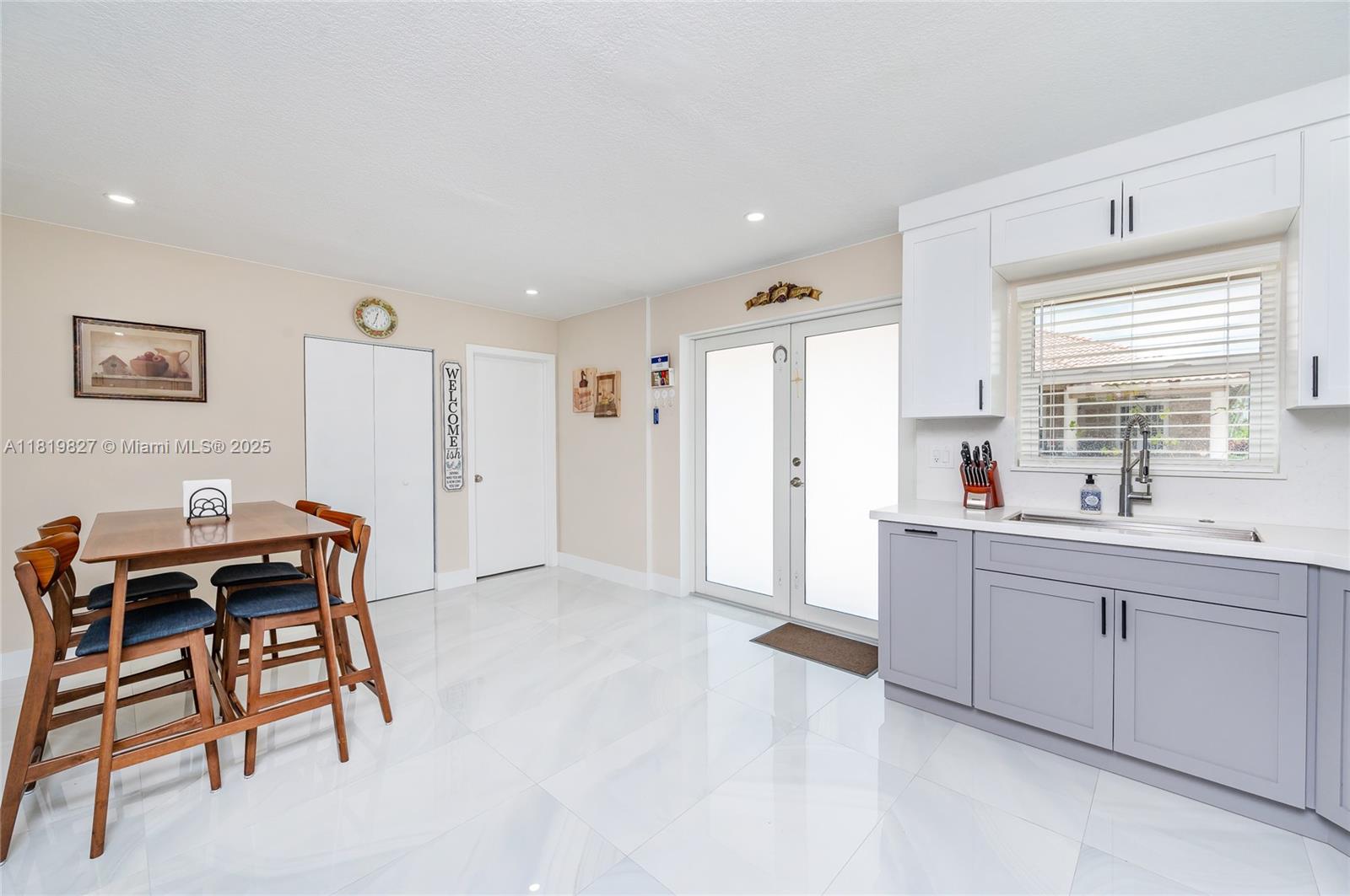 12851 Luray Road Southwest Ranches, FL 33330 - Photo 40 of 58 a kitchen with stainless steel appliances kitchen island granite countertop a sink and cabinets