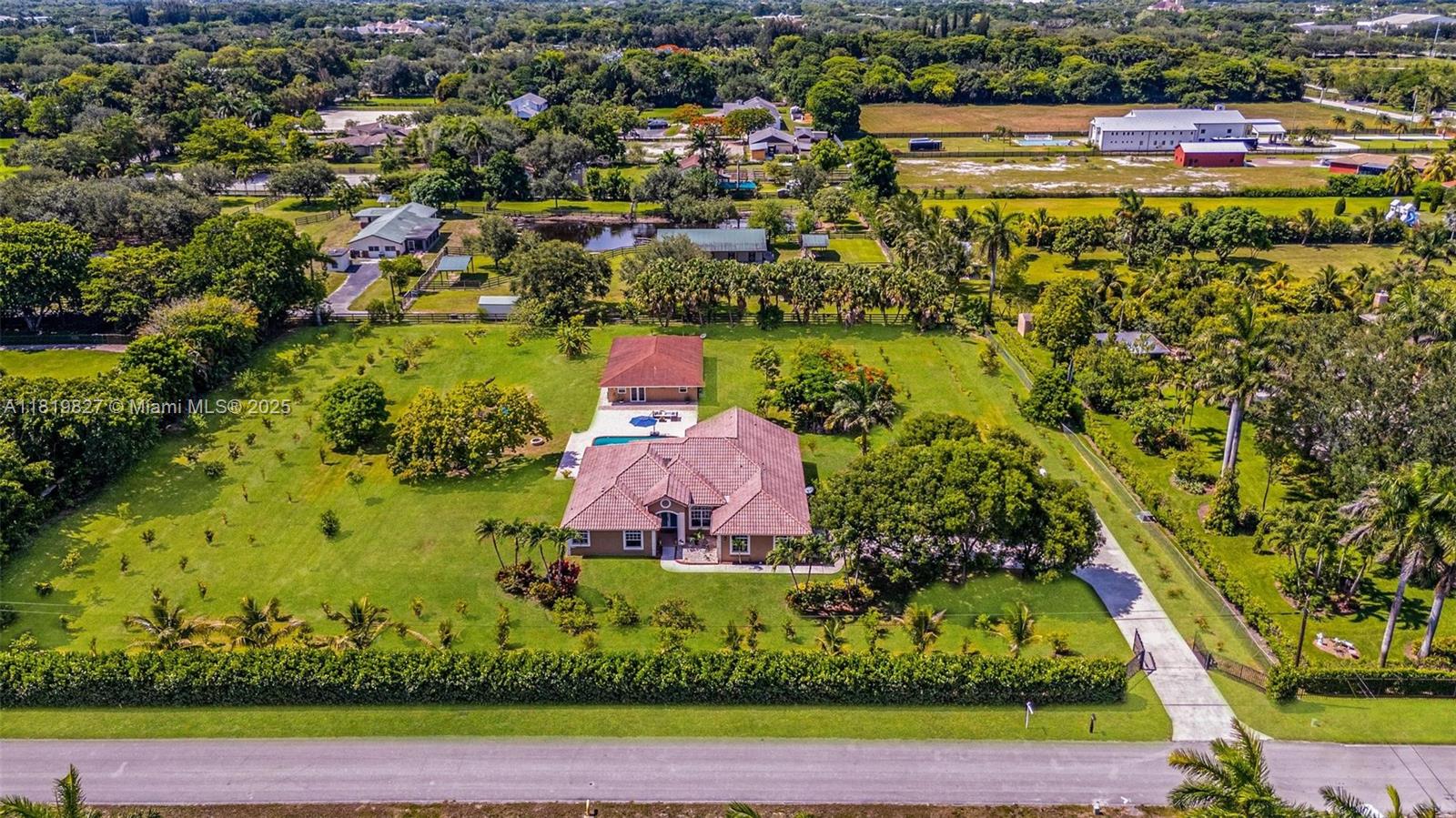 12851 Luray Road Southwest Ranches, FL 33330 - Photo 46 of 58 an aerial view of a residential houses with outdoor space and trees all around
